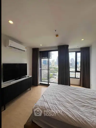 Modern bedroom with city view, featuring a large window, air conditioning, and sleek furniture.