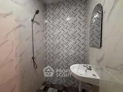 Modern bathroom with stylish tile design and sleek fixtures