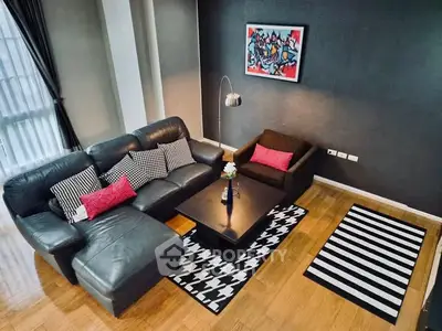 Stylish modern living room with leather sofa and chic decor