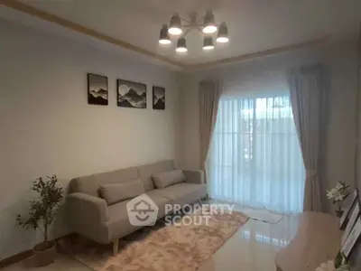 Stylish living room with modern sofa and elegant lighting, perfect for relaxation.