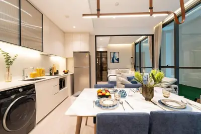 Modern open-layout kitchen and living room with stylish decor and natural light