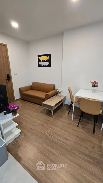 Modern living room with stylish furniture and wooden flooring