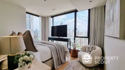 Luxurious bedroom with floor-to-ceiling windows offering a panoramic city view, complemented by modern furnishings and tasteful decor.