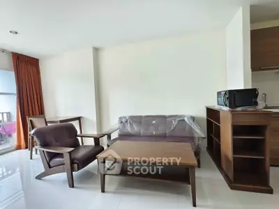 Modern living room with stylish furniture and natural light in a cozy apartment.