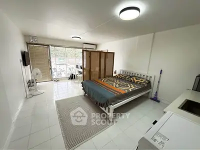 Spacious studio apartment with modern decor and natural light