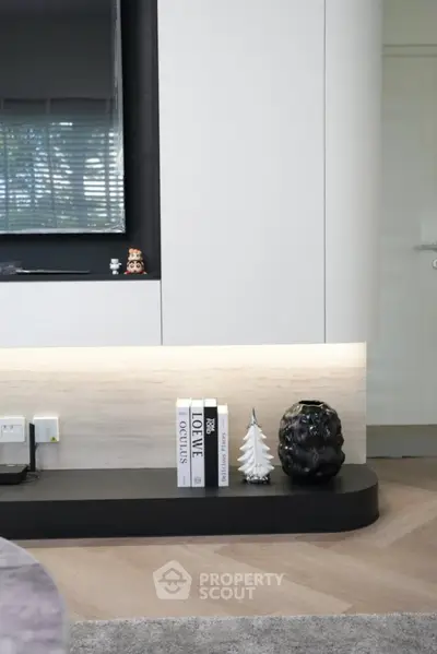 Modern living room with stylish decor and sleek cabinetry