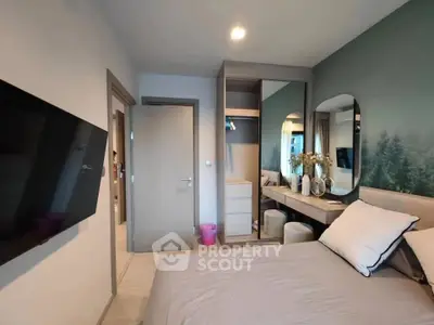 Modern bedroom with wall-mounted TV and stylish decor