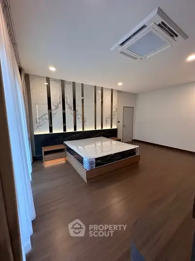 Spacious modern bedroom with elegant design and natural light