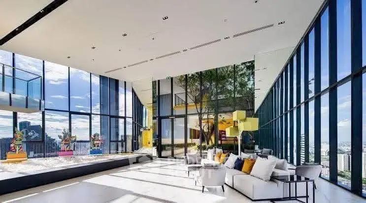Luxurious modern living room with floor-to-ceiling windows and stunning city view