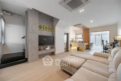 Spacious modern living room with open kitchen and cozy sectional sofa