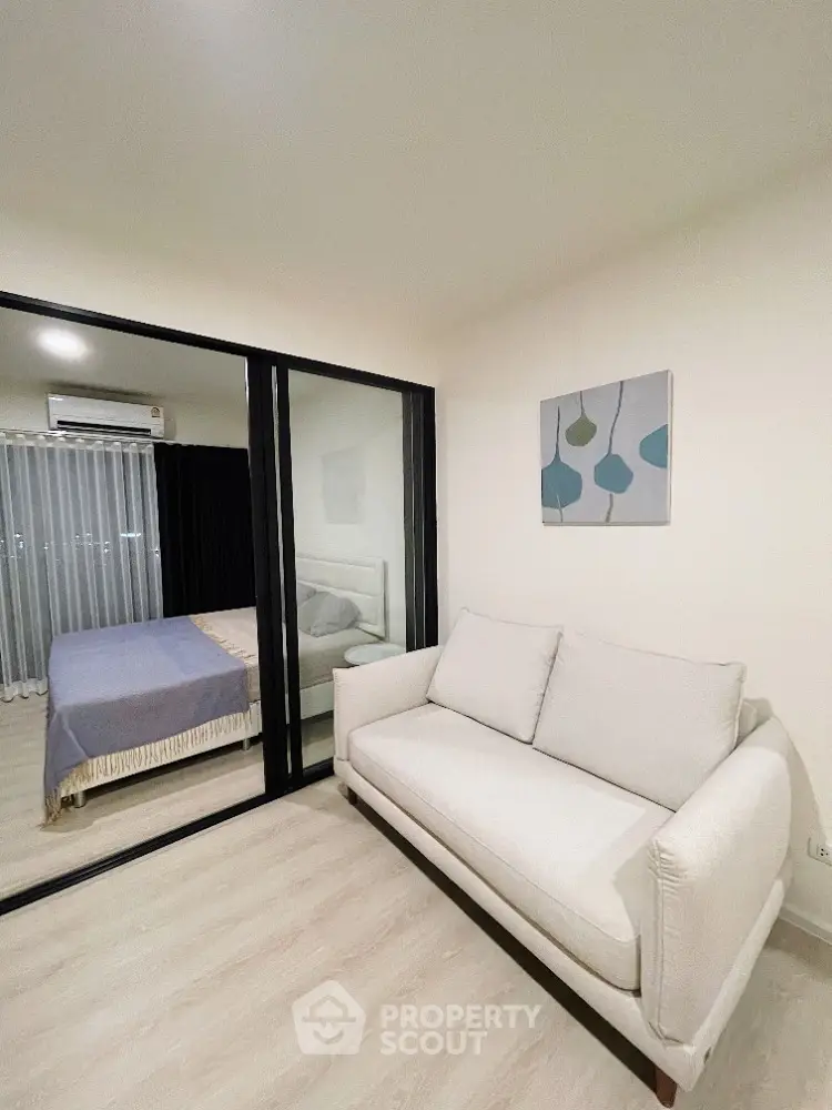 Modern apartment interior with cozy living room and bedroom view