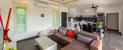 Spacious modern living room with open kitchen and stylish decor