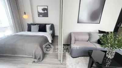 Modern bedroom with stylish decor and cozy seating area