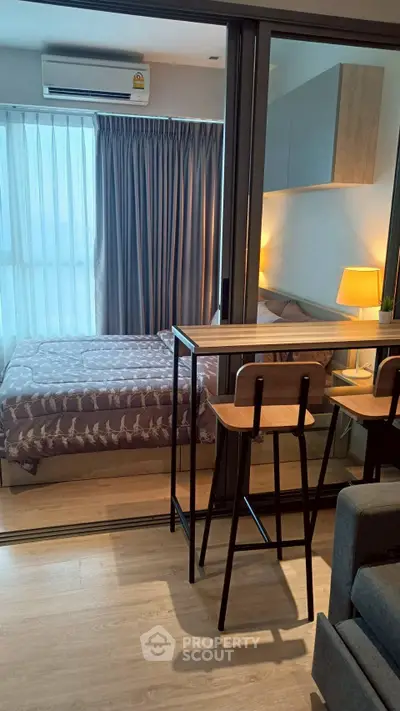 Modern studio apartment with cozy bedroom and stylish furniture