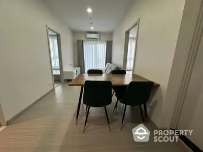 Modern dining area with stylish table and chairs in a bright apartment