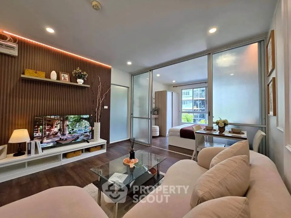 Modern open-plan living room with stylish decor and natural light