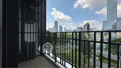 Spacious balcony with stunning city skyline view, perfect for relaxation and enjoying urban living.