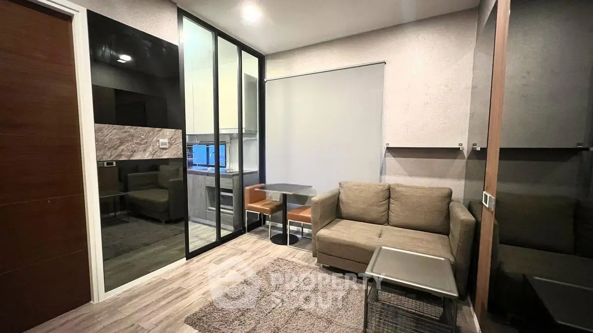 Modern living room with cozy sofa and stylish decor in a contemporary apartment.
