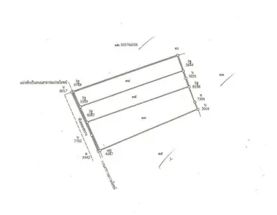 Detailed schematic plan of a real estate plot with measurements and boundaries.