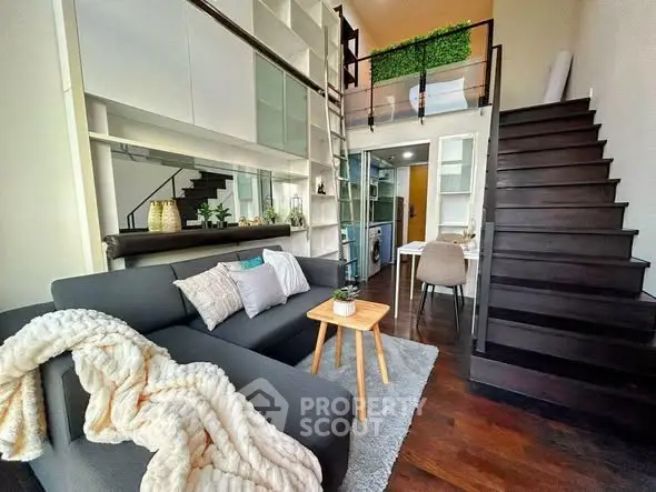 Modern loft-style living room with mezzanine and stylish decor