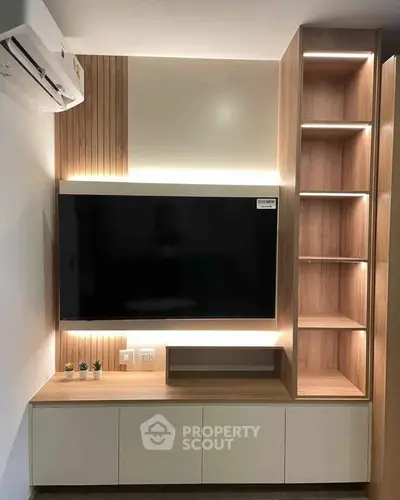 Modern living room with sleek TV unit and ambient lighting