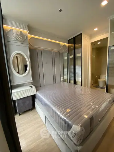 Luxurious bedroom with elegant decor and modern furnishings in a high-end apartment.