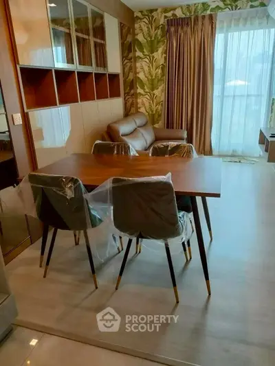 Modern living room with stylish dining area and large window view