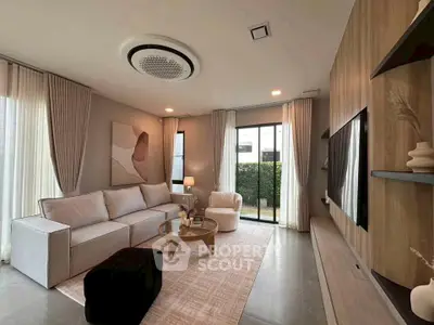 Modern living room with stylish decor and large windows