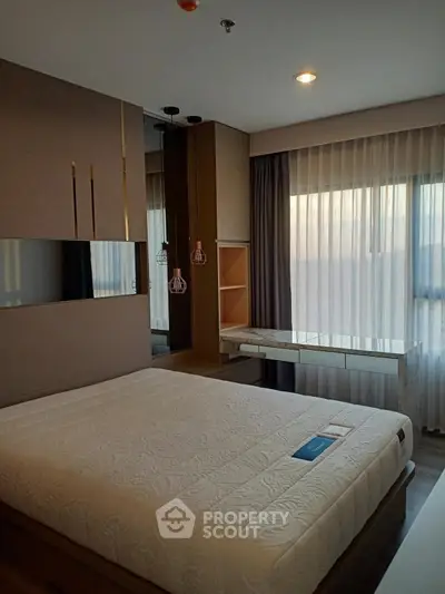 Modern bedroom with large window and stylish decor