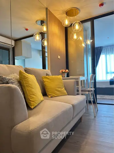 Modern living room with stylish decor and cozy ambiance in a contemporary apartment.