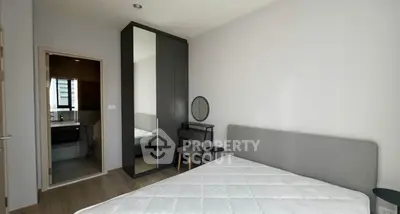 Modern bedroom with ensuite bathroom and sleek furniture