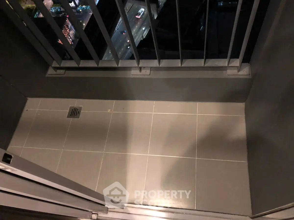 Cozy balcony with city view, perfect for relaxation and enjoying urban scenery.