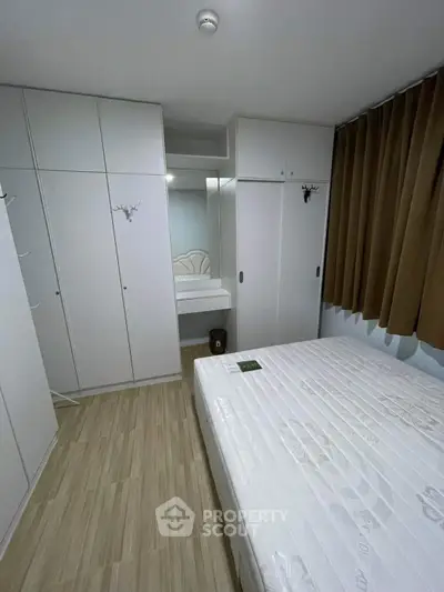 Cozy bedroom with ample storage and modern design