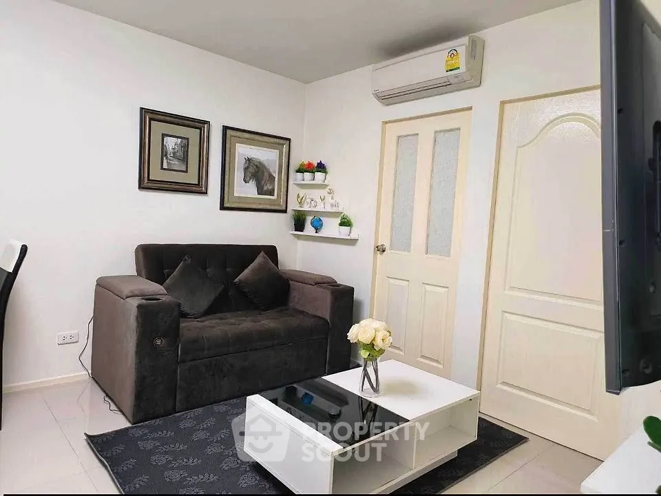Chic living room with modern decor, featuring a plush sofa, stylish coffee table, and elegant wall art.