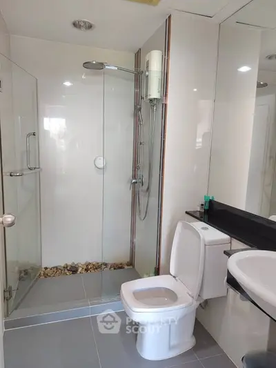 Modern bathroom with glass shower and sleek fixtures
