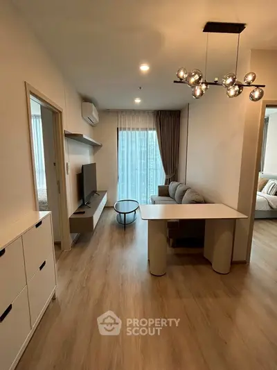 Modern living room with stylish lighting and cozy seating area