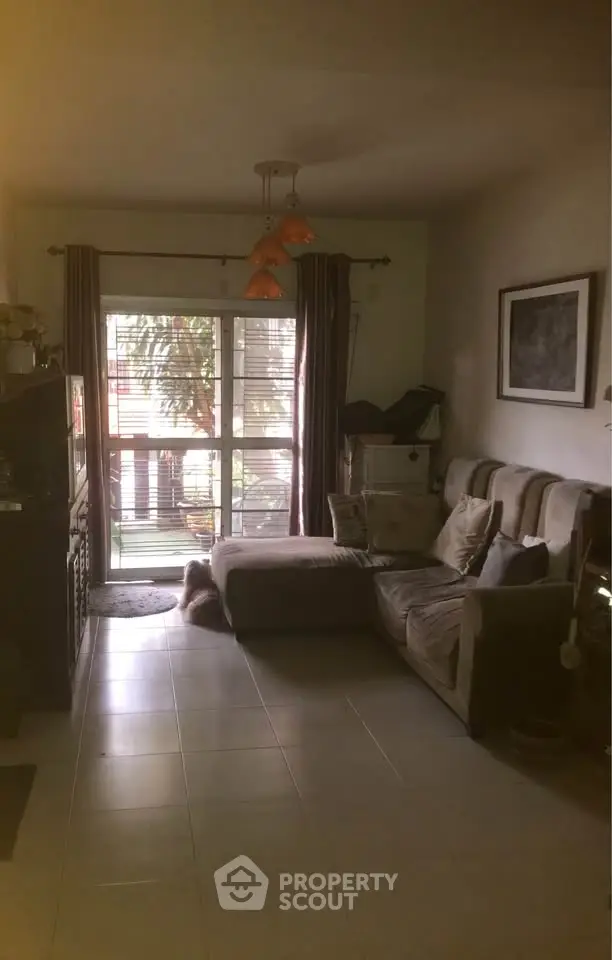 Cozy living room with sectional sofa and large window view