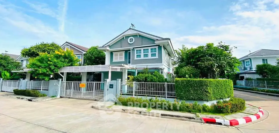 Charming suburban house with lush greenery and modern design in a peaceful neighborhood.