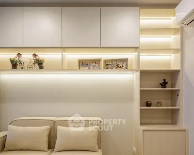 Modern living room with built-in shelves and cozy sofa, perfect for relaxation.