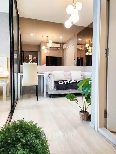 Modern living room with elegant decor and stylish lighting in a cozy apartment.