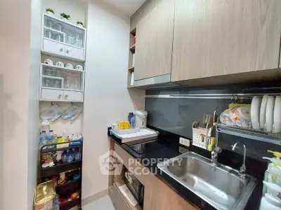 Modern compact kitchen with sleek cabinetry and efficient storage solutions