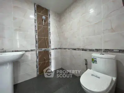 Modern bathroom with sleek tiles and contemporary fixtures