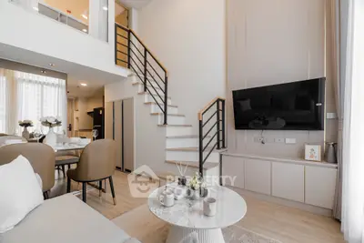 Modern open-plan living room with stylish decor and mezzanine level