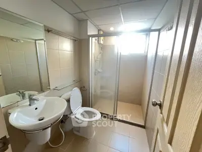 Modern bathroom with glass shower and sleek fixtures