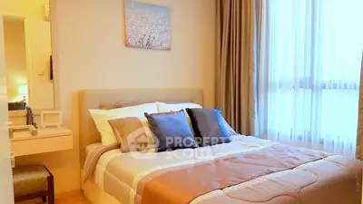 Cozy bedroom with elegant decor and large window for natural light