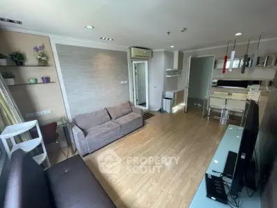 Spacious modern living room with stylish decor and wooden flooring