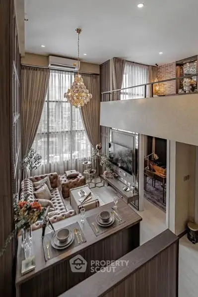 Luxurious loft-style living room with high ceilings and elegant decor
