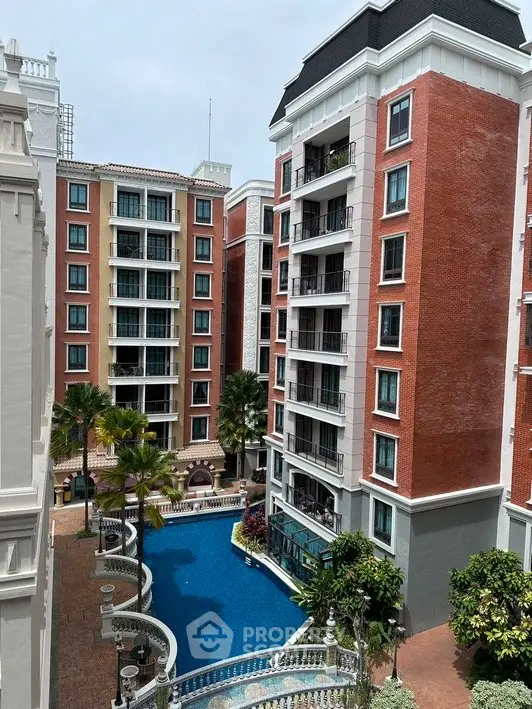 Luxurious apartment complex with pool and elegant architecture