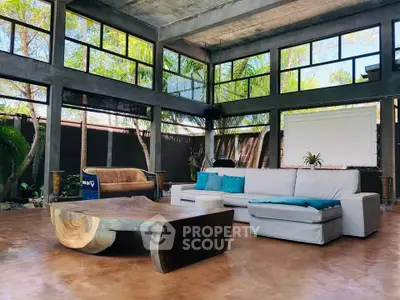 Stunning modern living room with large windows and unique wooden coffee table