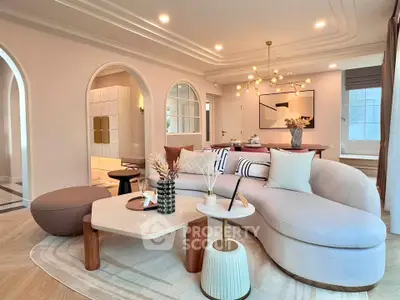 Luxurious modern living room with elegant curved sofa and stylish decor